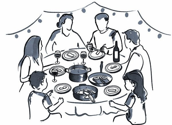 Line sketch of a family gathered around a dinner table with Legend pots and pans